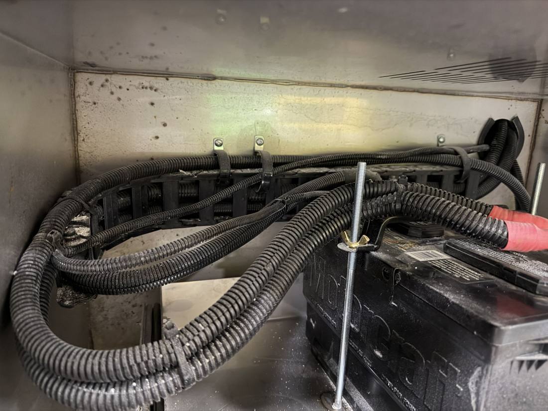 Wire-loomed battery wiring