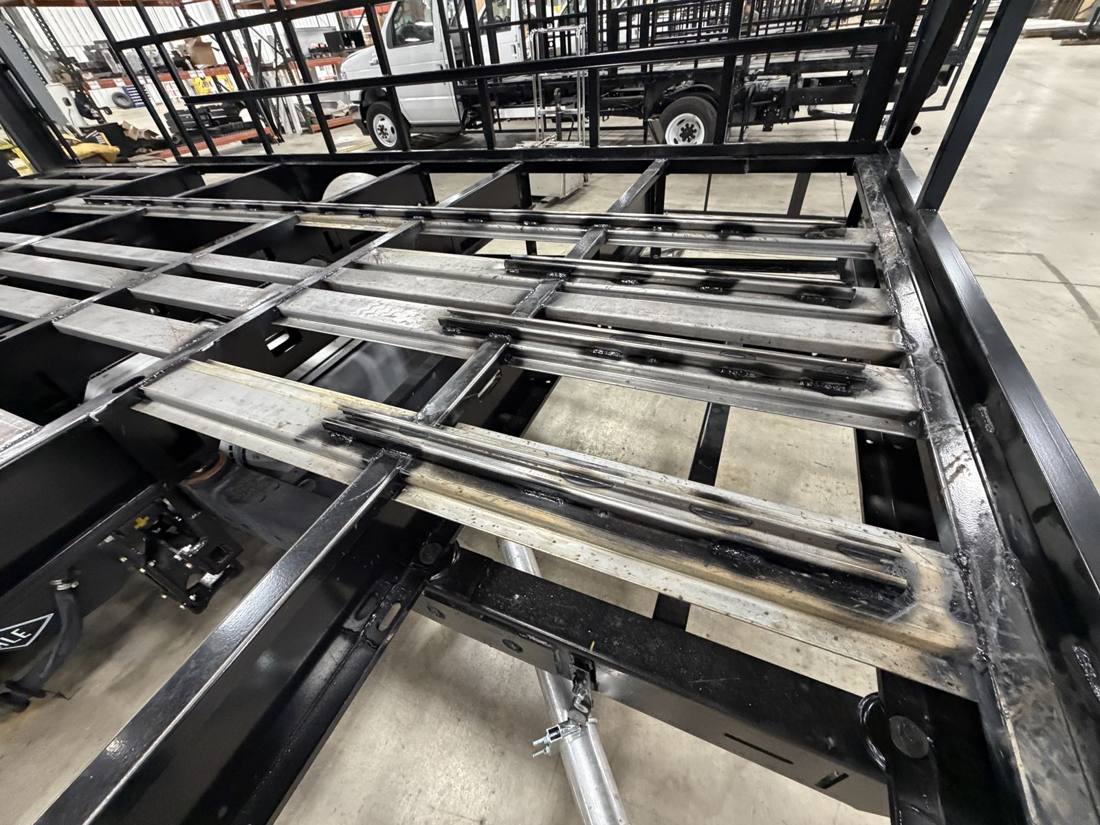 Laser-cut floor crossmembers with rounded ends