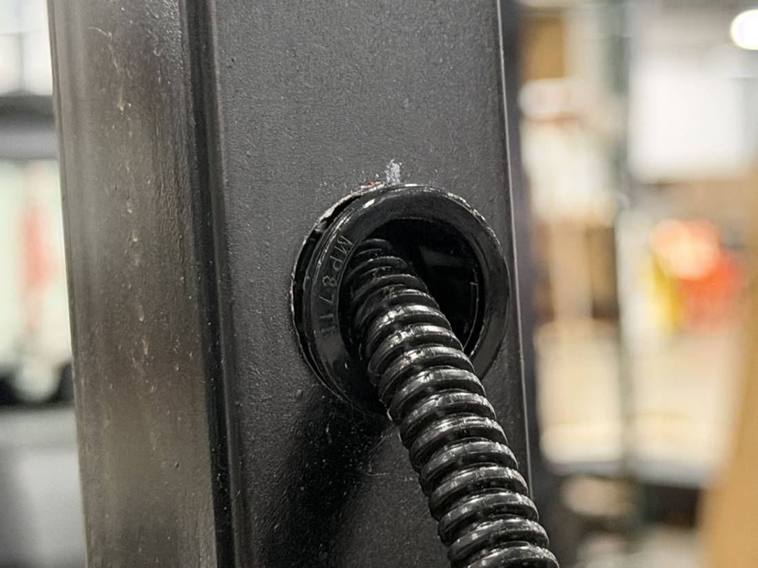 Laser-cut, grommeted wire pass-through