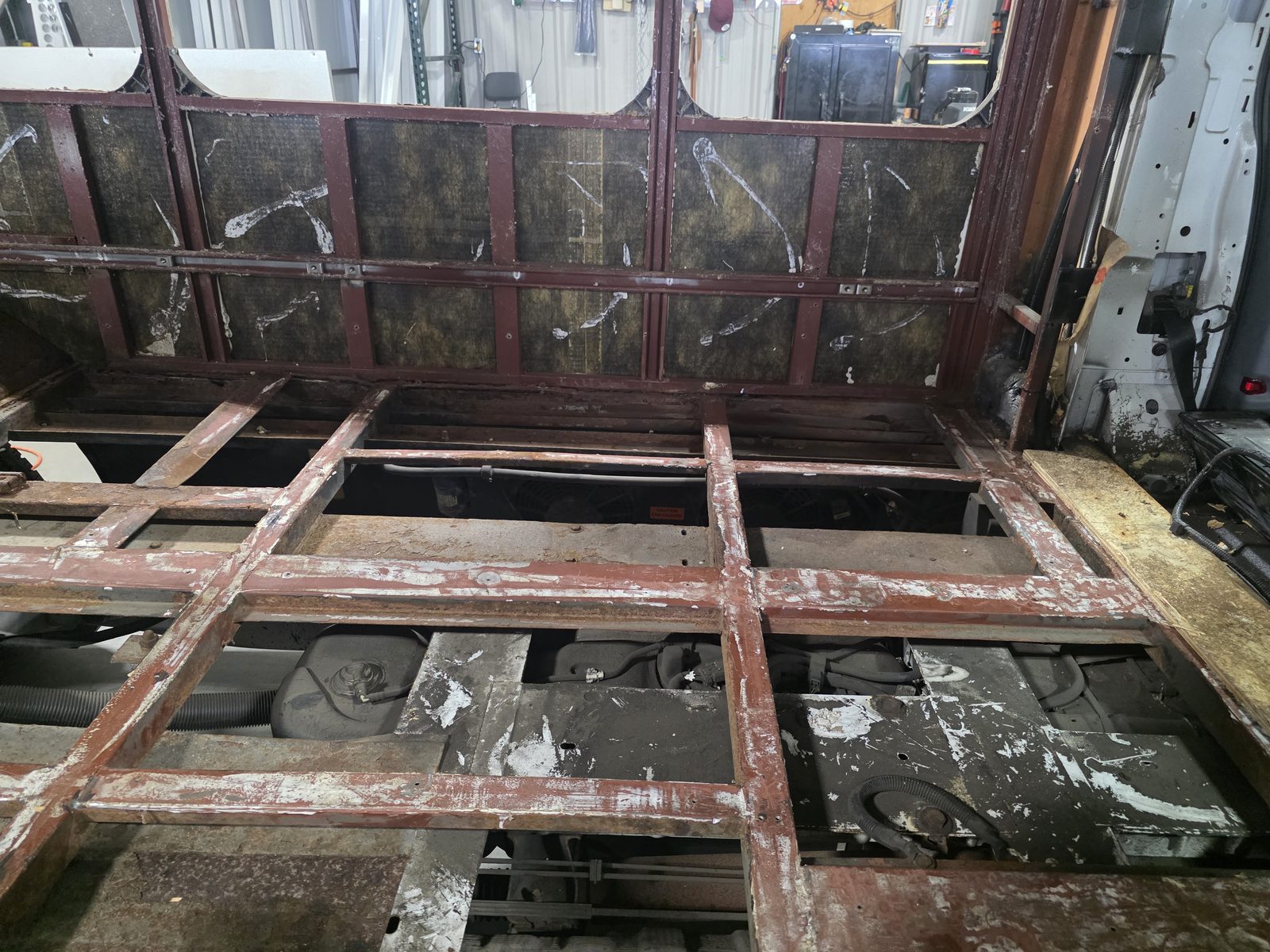 Rusted floor crossmembers with the decking removed