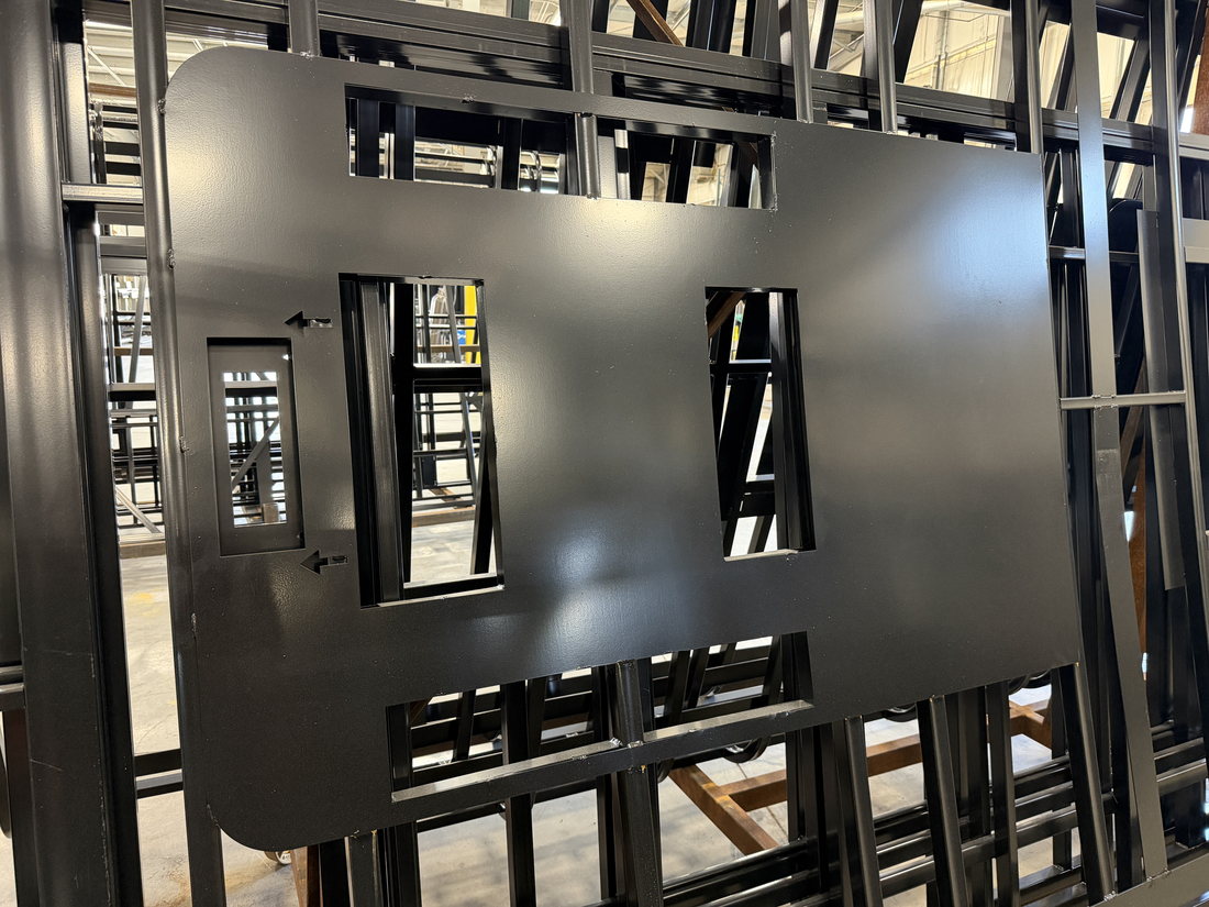 Powder-coated laser-cut steel roof reinforcement plate for roof-mounted A/C equipment